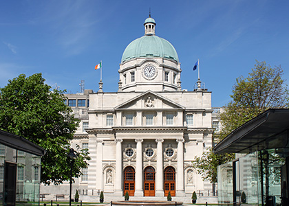 Photograph of the Dáil (Irish Parliament building) against a blue sky